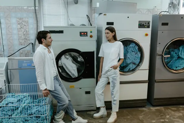 Two people taking care of laundry